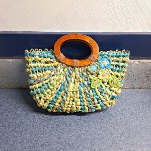 Capelli Straworld INC Woven Straw Bag with floral Embellishments
